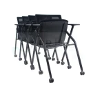 Silla Elba con paleta abatible, estructura metálica negra.