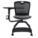 Silla escolar móvil con paleta y respaldo perforado.
